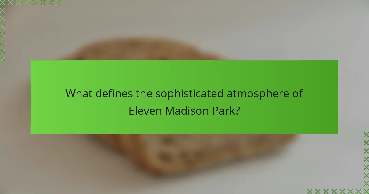 What defines the sophisticated atmosphere of Eleven Madison Park?